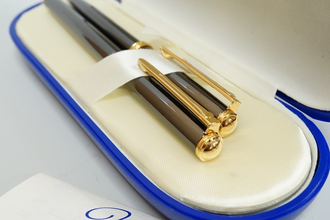 A cased Messenger pen and pencil set, a Waterman pen, etc.